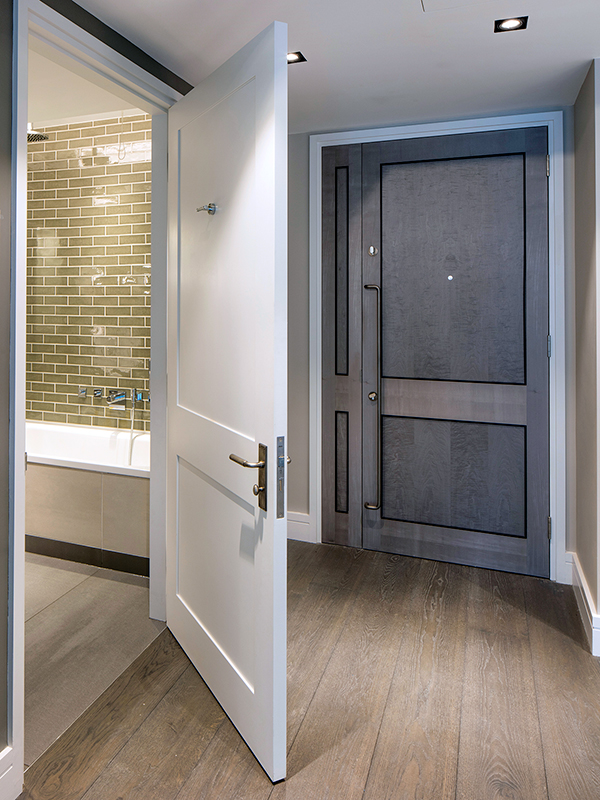 Dyed grey sycamore veneer and white painted finished doors at 21 Young Street